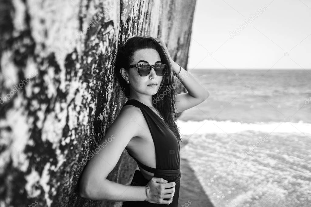 Long hair bruntte girl relaxing on the beach 