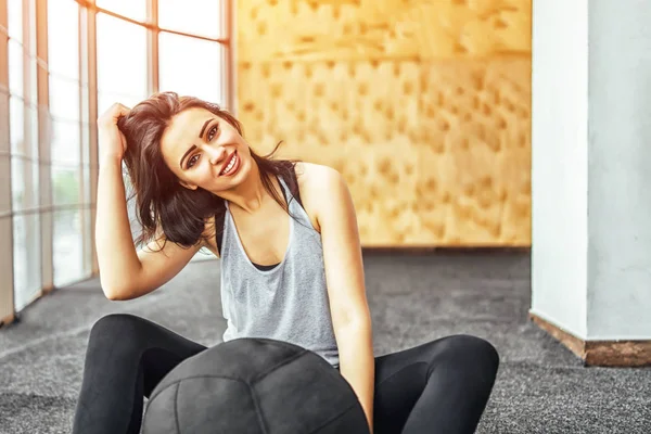 Sporty Woman Fixing Hair While Sitting Slam Ball Gym — Stock Photo, Image