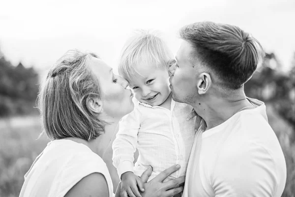 Young Parents Kissing Cheeks Little Son Outdoor — Stock Photo, Image