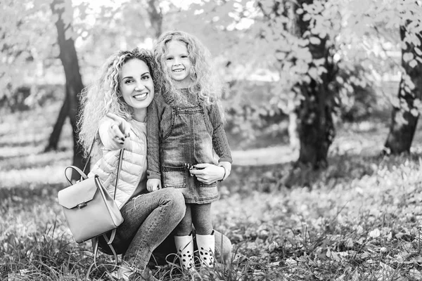 Mother Embracing Her Little Daughter While Having Fun Park — Stock Photo, Image