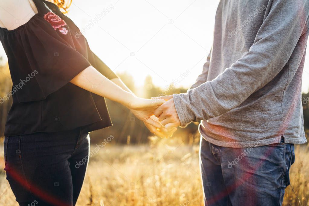 Pretty young romantic couple spend time together outdoor