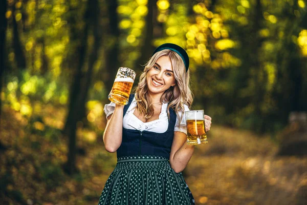 Pretty Happy Blonde Dirndl Traditional Festival Dress Sitting Two Mugs — Stock Photo, Image