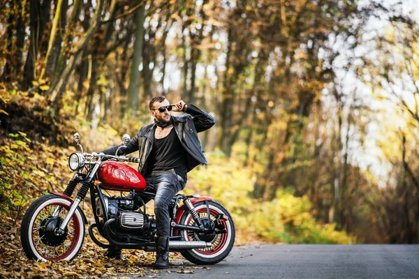 Bearded Brutal Man Sunglasses Leather Jacket Sitting Motorcycle Road Forest — Stock Photo, Image