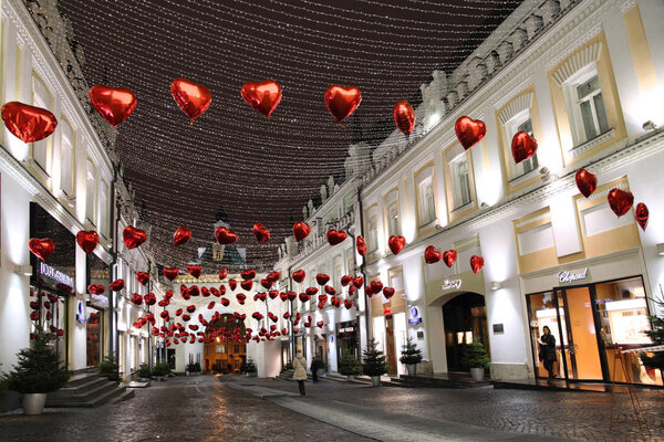 Balloons in the form of red hearts decorate the street for Valentine's Day. Tretyakov passage. Moscow. 12.02.2015