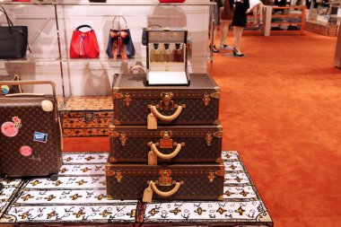 Showcase with Trendy suitcases and bags in the luxury Louis Vuitton store. Moscow. 01.11.2018 clipart