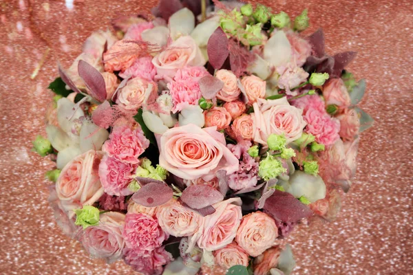 Huge beautiful Light pink bouquet with roses on a sparkling shiny background