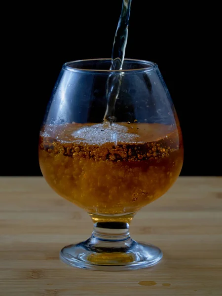 Filling Glass Fresh Apple Juice Wooden Surface Black Background — Stock Photo, Image