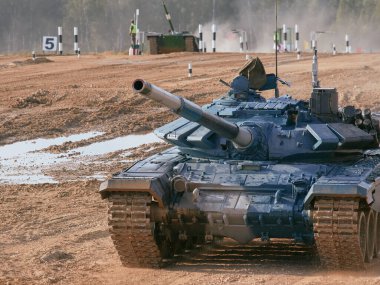 Modern tank at the tank biathlon competition in Alabino near Moscow during the Army-2020 forum clipart