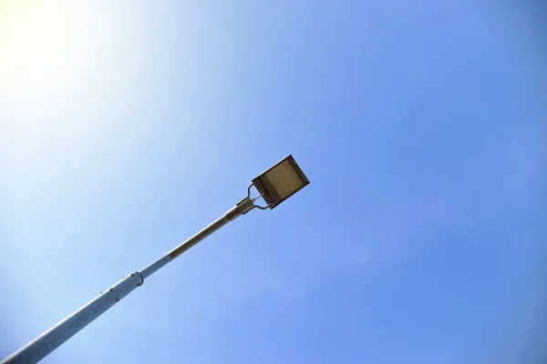 LED street light in the center of the frame, crop. Lantern on a background of blue light sky