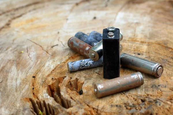 Spent Batteries Coated Corrosion Different Shapes Sizes Lie Edge Wooden — Stock Photo, Image