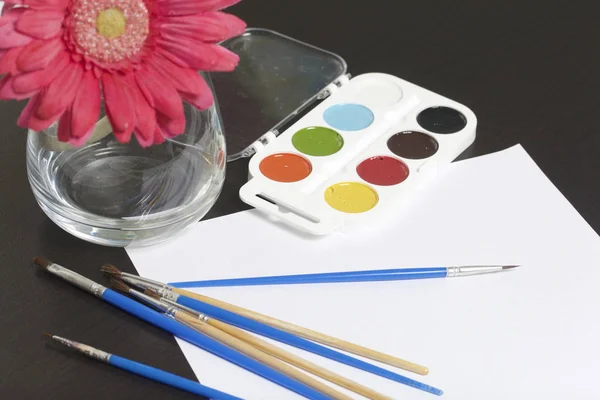 Watercolors Brushes Dark Surface Nearby Artificial Flower Vase Still Life — Stock Photo, Image