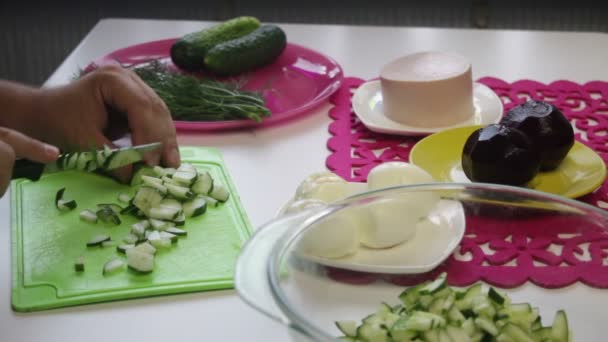 Man Takes Cucumber Plate Starts Cutting Cutting Board Nearby Dishes — Stock Video