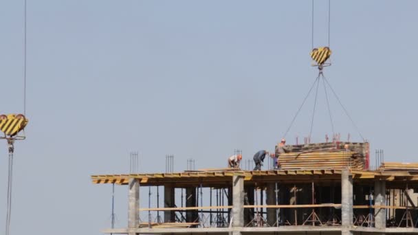 Construction Building Frame Made Concrete Construction Workers Moving Tower Crane — Stock Video