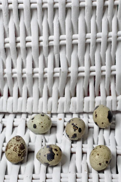 Quail Eggs Lie Surface Wicker Vine White Background — Stock Photo, Image