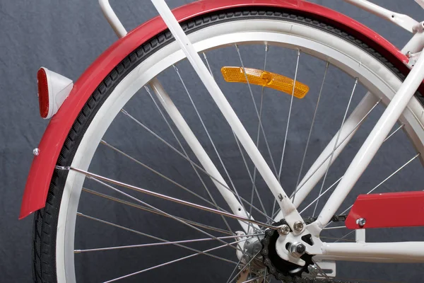 Elements of a female bicycle in white and pink color.  Trunk and wheel. Spring and summer recreation and sports.