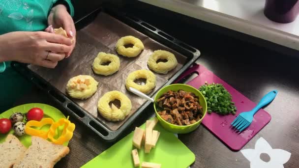 Woman Fills Potato Rings Filling Fried Mushrooms Next Sliced Onion — Stock Video