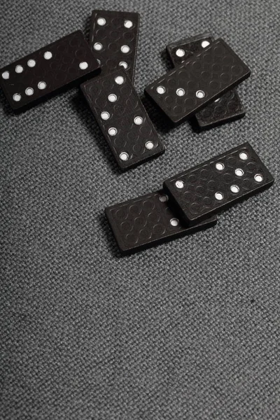 Domino knuckles on a surface covered with a coarse gray cloth. — Stock Photo, Image