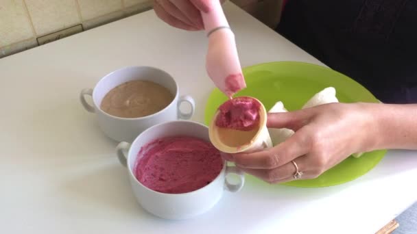 Woman Fills Horn Strawberry Ice Cream Using Ice Cream Spoon — Stock Video