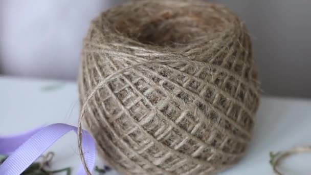 Coil of decorative twine. For dressing bouquets. Close-up shot. — Stock Video