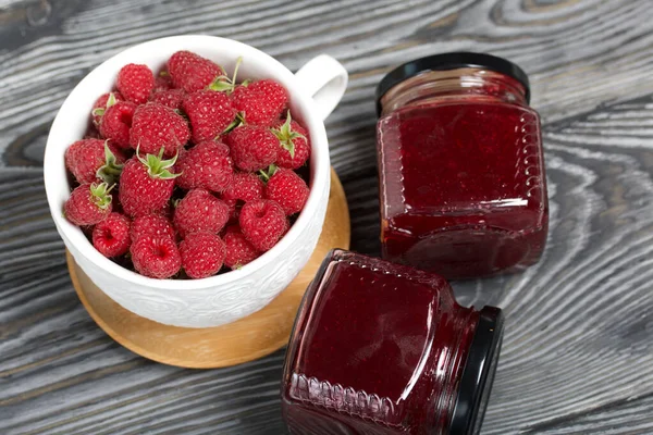 Raspberry Jam Glass Jars Nearby Raspberries Large White Mug Wooden — Stock Photo, Image