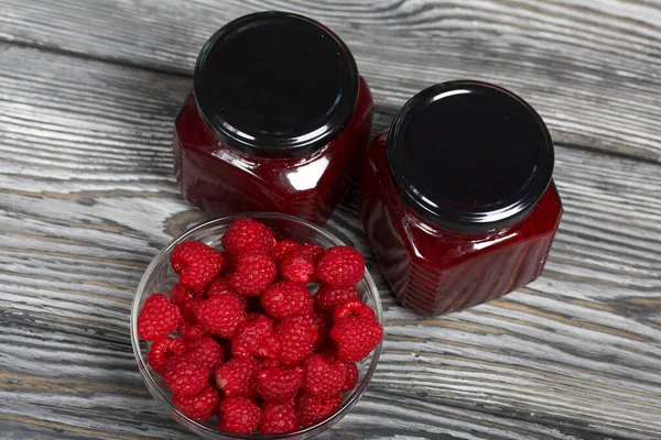 Raspberry Jam Glass Jars Nearby Raspberries Container Wooden Boards Beautiful — Stock Photo, Image