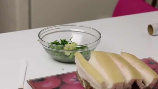The chopped fat lies on the board. Container contains parsley and garlic. Salted lard with herbs and spices. — Stock Footage The chopped fat lies on the board. Container contains parsley and garlic. Salted lard with herbs and spices. Royalty Free Stock Footage