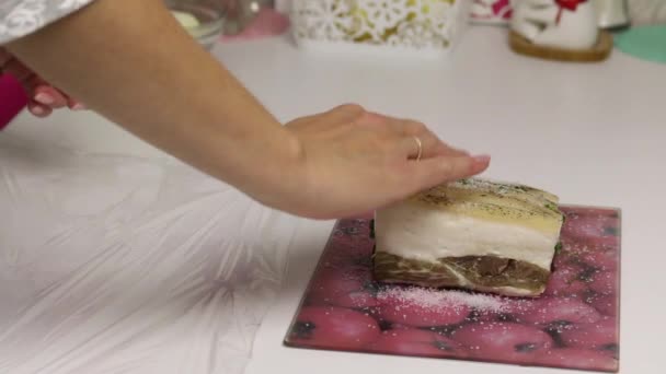 The woman puts the chopped onions on plastic wrap. Nearby lies a piece of bacon, cut into an accordion. Filled with parsley and adjika. Salted lard with herbs and spices. — Stock Footage The woman puts the chopped onions on plastic wrap. Nearby lies a piece of bacon, cut into an accordion. Filled with parsley and adjika. Salted lard with herbs and spices. Royalty Free Stock Video