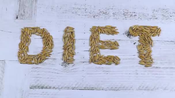 Word Diet Written Oat Grain White Wooden Background Shaken Hand — Stock Video