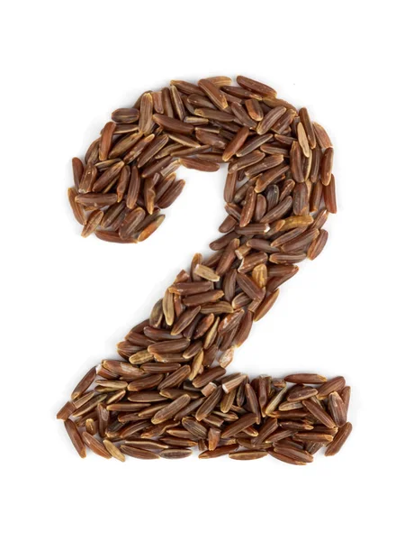Arabic numeral 2 of brown rice grains on an isolated white background. — Stock Photo, Image