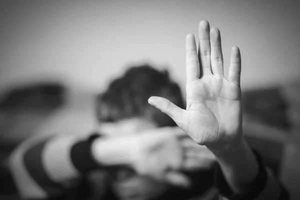 Stop hand of child, sign of discrimination or anti violence symbol.black and white.