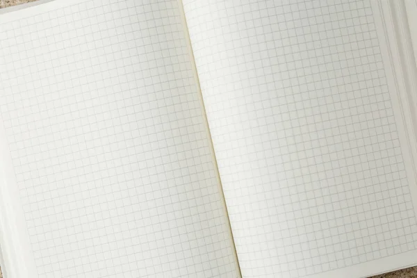 Open notebook on the table top view, with blank page — Stock Photo, Image