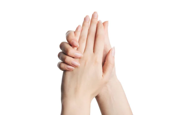 Mooie vrouwenhanden aanbrengen van crème, masseren geïsoleerd — Stockfoto
