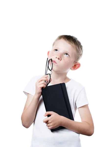 Schoolboy holding a notebook in hands isolated on a white background — Stock Photo, Image