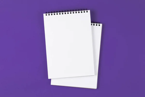 Open notebook on the violet background — Stock Photo, Image