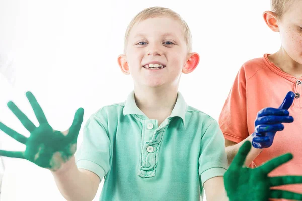 Boy paint with hands drawing lesson at school — Stock Photo, Image