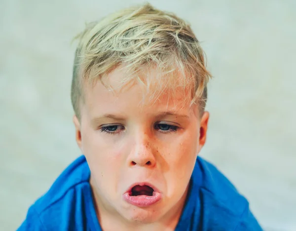 Close up portrait opened dissatisfied mouth freckled blond boy artistic facial expressions, gestures mischievous. Funny photo, simple joys of childhood, children behaviour education problems concept — Stock Photo, Image