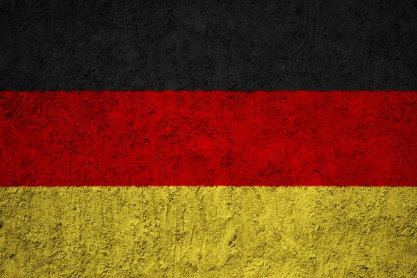 グランジのコンクリート壁にドイツの国旗 — ストック写真