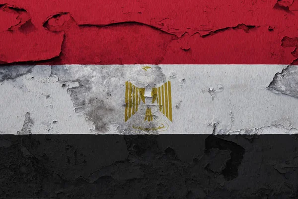 Egypt flag painted on the cracked concrete wall