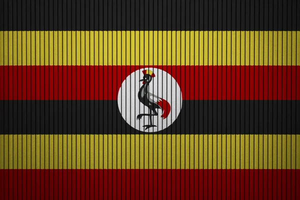 水泥墙上的乌干达漆旗 — 图库照片