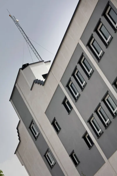 Building facade with square windows and sky