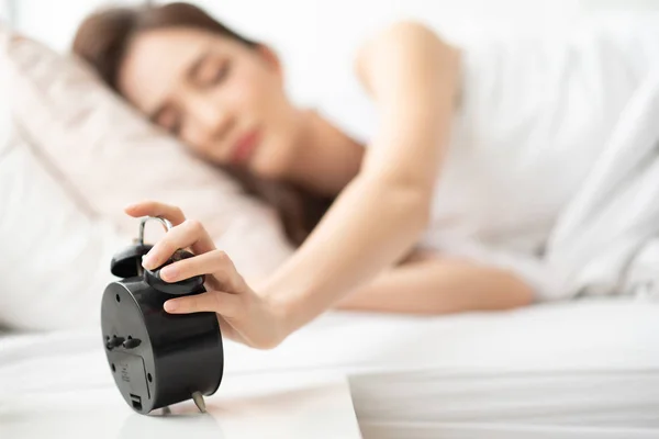 Sleepy Asian Woman Holding Alarm Clock While Her Lying Bed — Stock Photo, Image