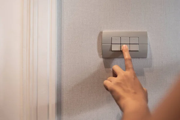 Turning on or off on light switch. — Stock Photo, Image