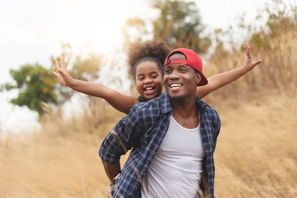 Happy Black Father Smiling Having Fun Giving Piggyback Ride Joyful — Stock Photo, Image