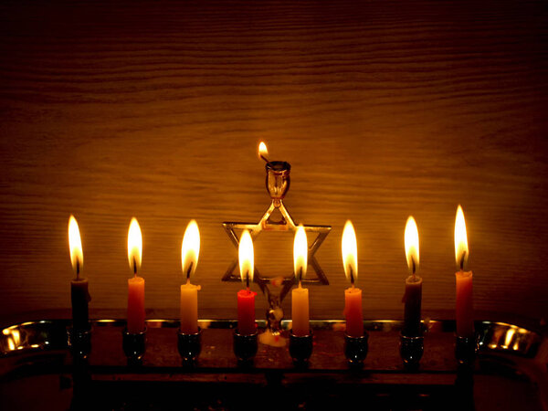 Hanukkah is a Jewish holiday. Burning Chanukah candlestick with candles. Chanukiah Menorah
