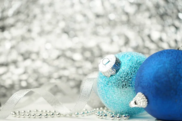 Christmas card with Christmas tree toys blue and silver balls, ribbon, beads and Copy space