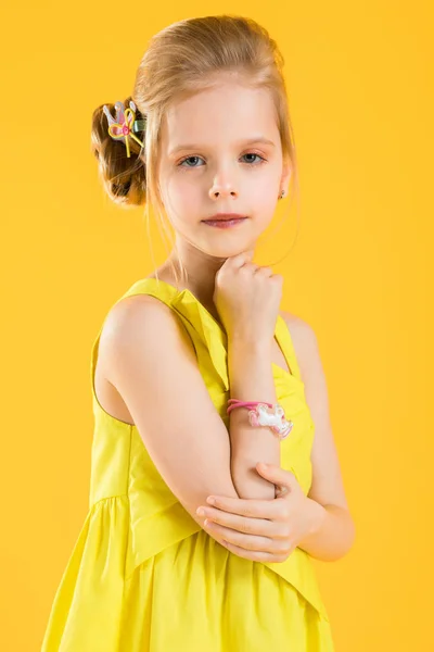 Girl posing on yellow background. — Stock Photo, Image