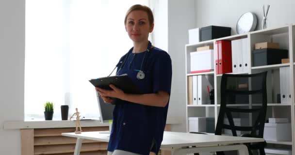 Doctor Holding Papers Hands Leaning Table — Stock Video