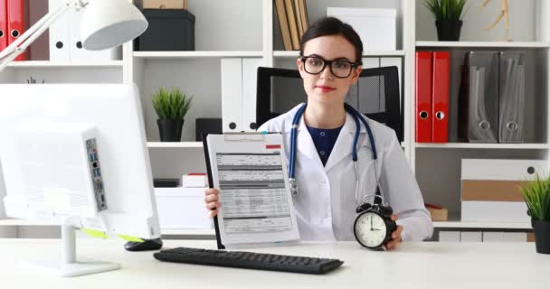 Doctor Showing Documents Clock Camera Office — Stock Video