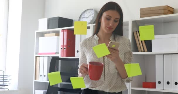 Businesswoman Standing Glass Wall Sticky Notes Using Smartphone — Stock Video