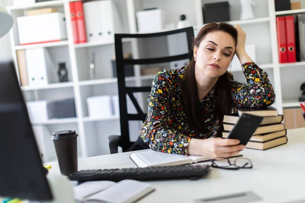 Tired Economist Using Smartphone While Leaning Stack Books Workplace Office — Stock Photo, Image